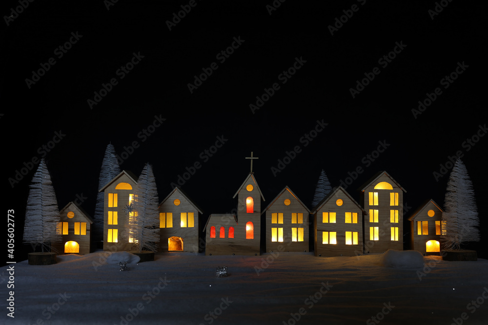 The layout of the town on Christmas night is made of plywood The layout of the town on Christmas night is made of plywood