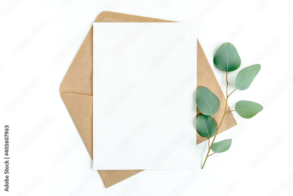 Mockup invitation, blank greeting card and green leaves eucalyptus. Flat lay, top view. Mockup invitation, blank greeting card and green leaves eucalyptus. Flat lay, top view.