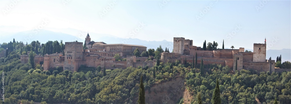 Fototapeta premium View of the streets and old buildings of Granada, historic city of Andalusia (Spain). The Alhambra from the viewerpoint of San Nicolas.
