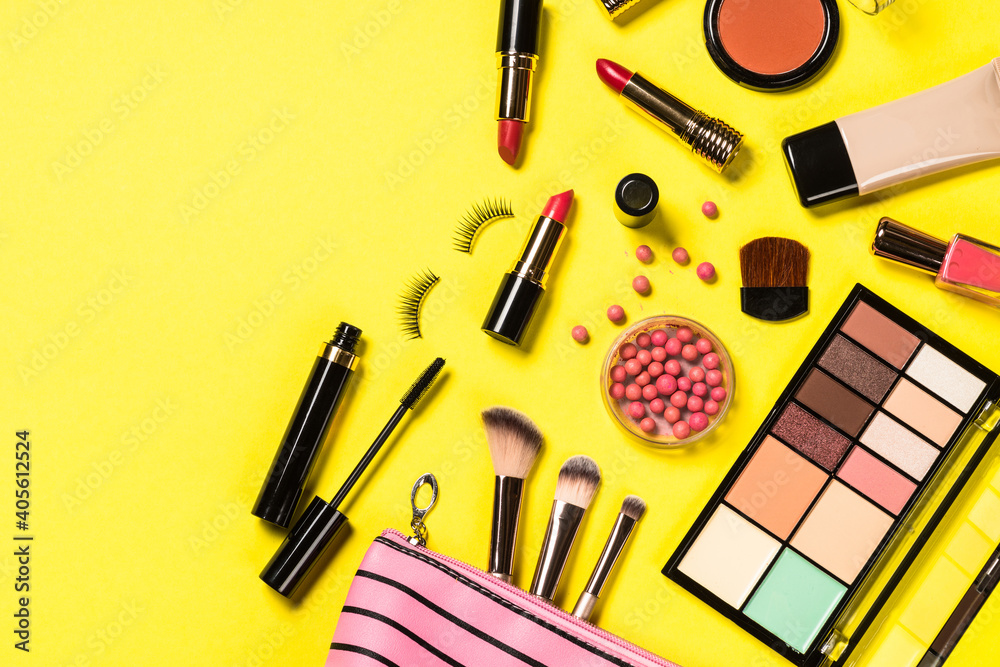 Makeup professional cosmetics on color background. Top view with copy space. Makeup professional cosmetics on color background. Top view with copy space.
