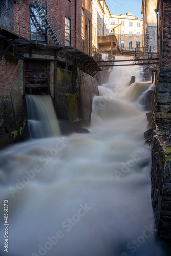 Kvarnbyn Waterfall flowing in old industrial work area