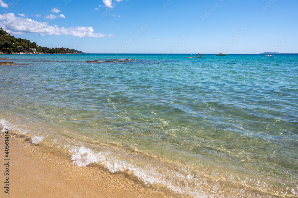 Obraz premium Summer vacation on French Riviera, crystal clear azure blue water of Mediterranean sea in Saint Clair near Le Lavandou, Var, Provence, France