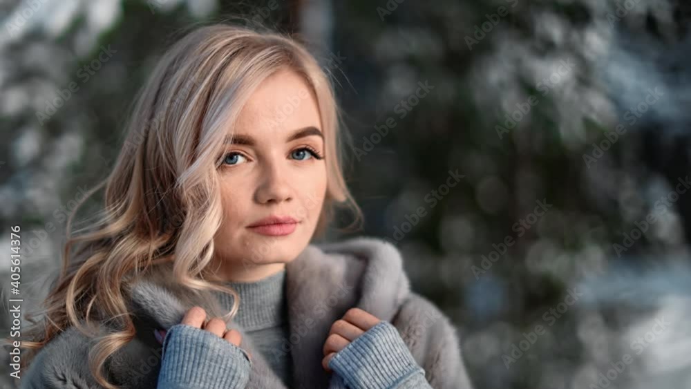 Portrait of seductive lady posing in grey fur coat at forest. Medium close up shot on 4k RED camera Portrait of seductive lady posing in grey fur coat at forest. Medium close up shot on 4k RED camera