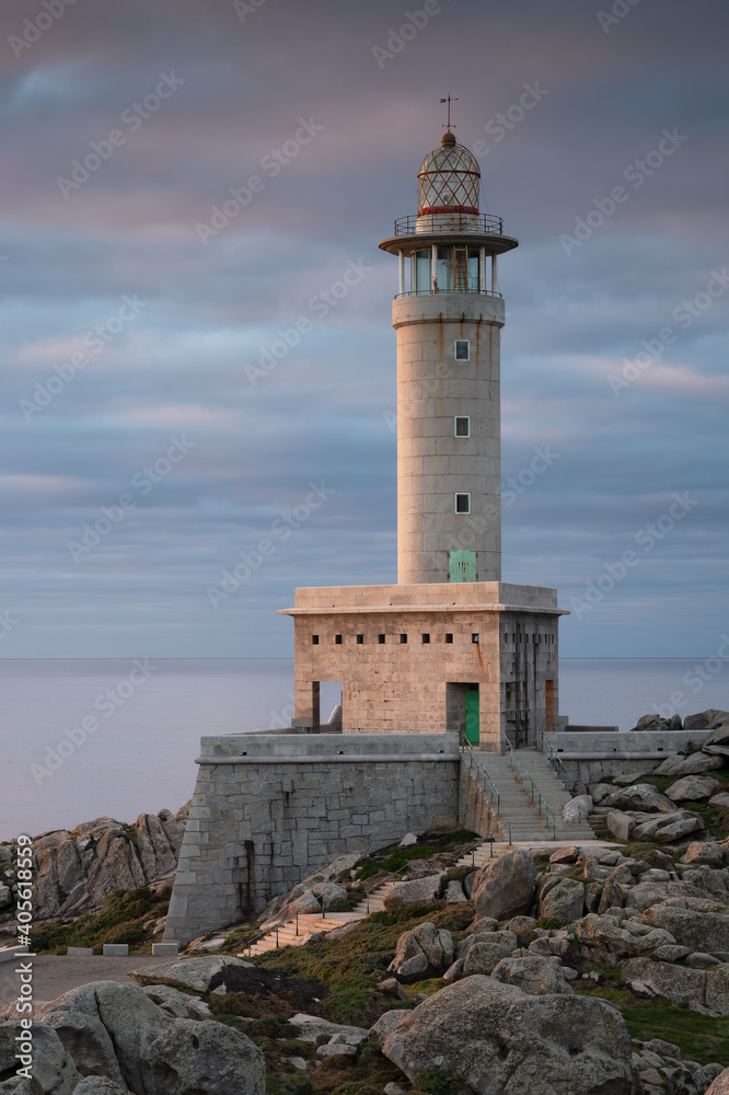 Beautiful vertical image of the Punta Nariga Lighthouse in Galicia, Spain. Ideal for magazine