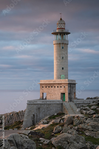 Beautiful vertical image of the Punta Nariga Lighthouse in Galicia, Spain. Ideal for magazine