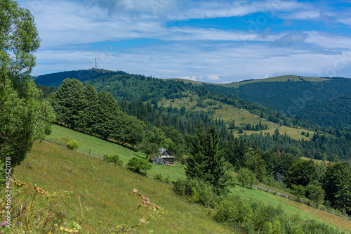 Beautiful summer landscape of village among Karpaty mountains