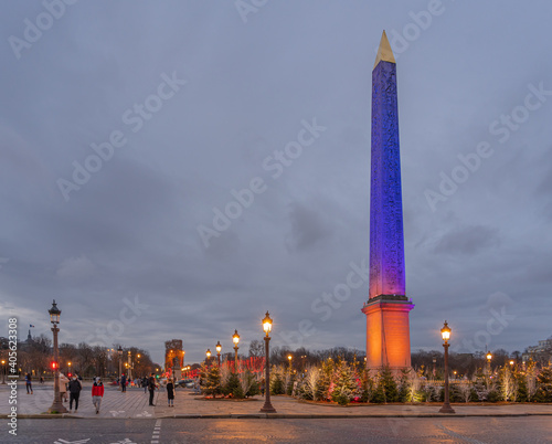 Paris,France - 12 30 2020: View of the Obelisk and the Arc De Triomphe on Place de la Concorde with Christmas lights