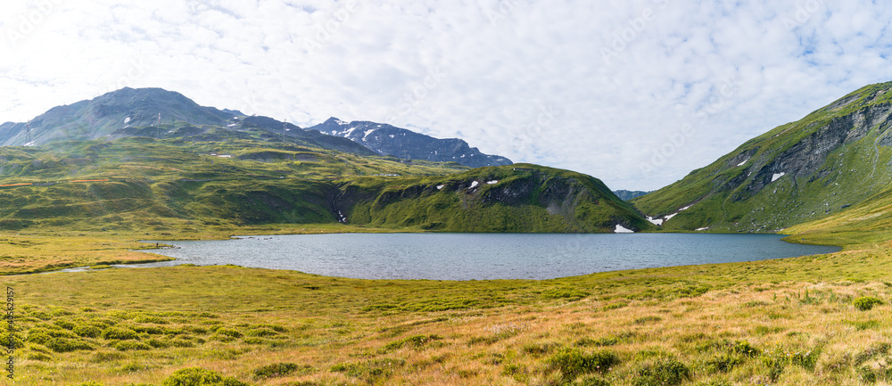 Fototapeta premium The mountains, meadows and lakes of the Aosta Valley near the town of La Thuile, Italy - August 2020.