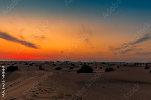 The glowing embers of the night sky after sunset in the desert outside Dubai, UAE in springtime