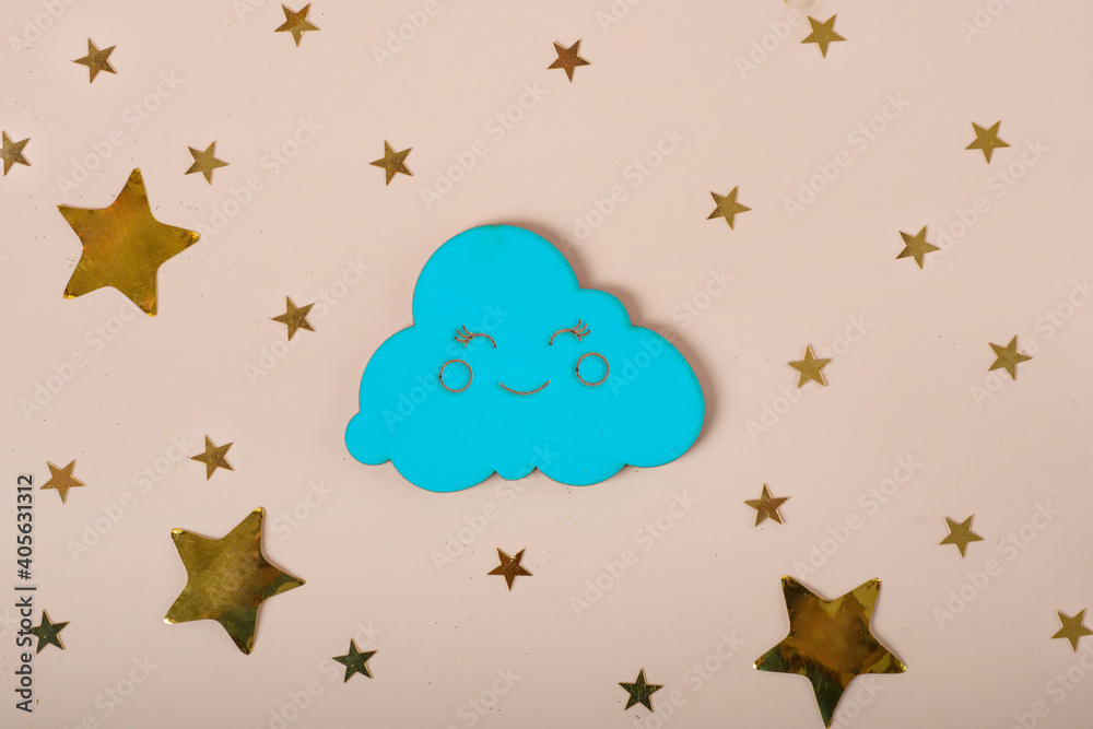 wooden cloud and stars on beige background wooden cloud and stars on beige background