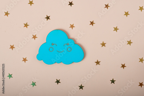wooden cloud and stars on beige background