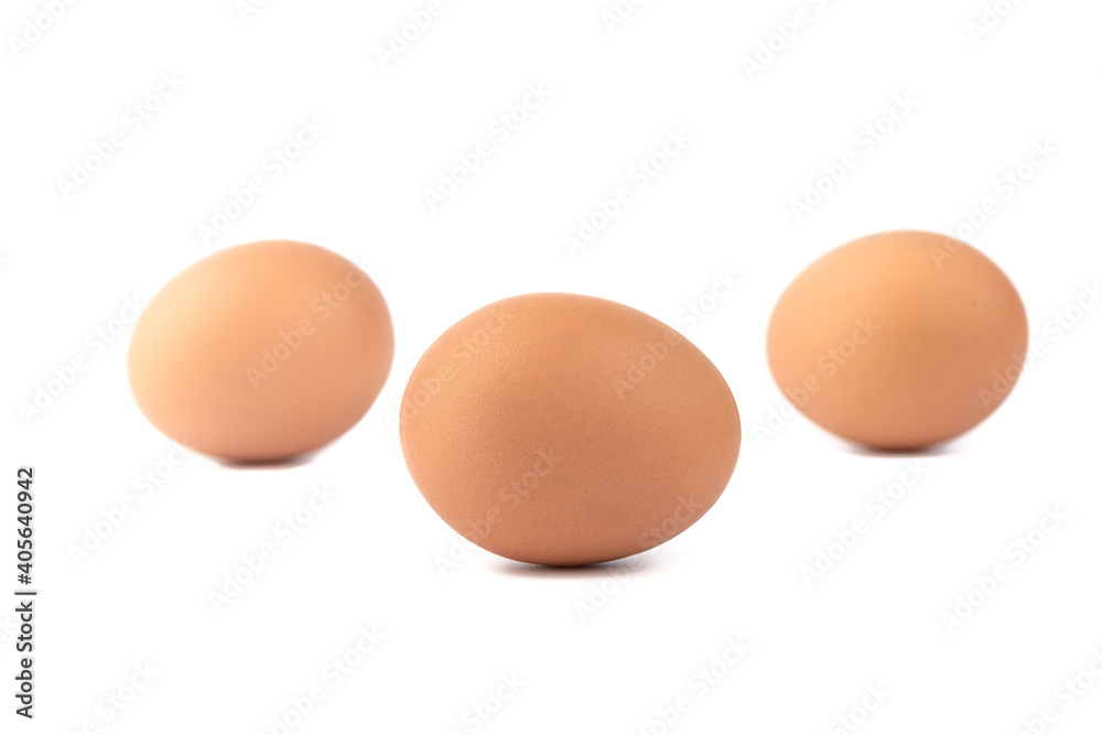 Soft focus. Three eggs over a white background. Soft focus. Three eggs over a white background.