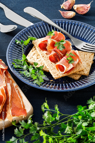 Crispy bread on a blue plate with a diet vegetable