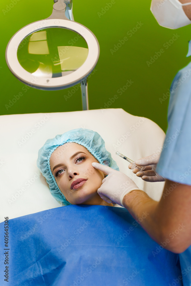 Filler injection in cheekbones. ?ontour plastic for correcting the ...