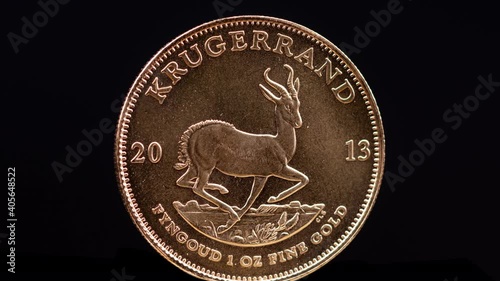 Rotating 1oz gold Krugerrand coin photo