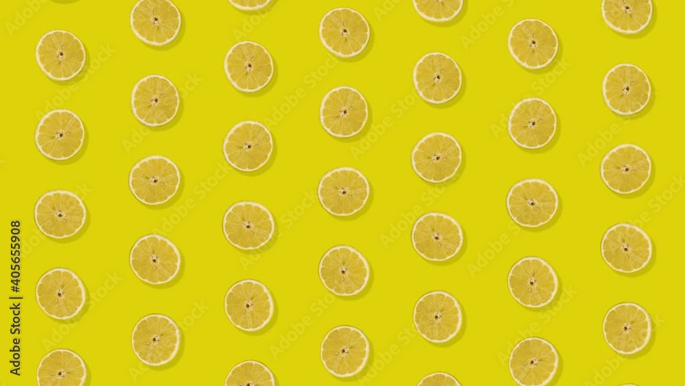 Lemons in a row against yellow background Lemons in a row against yellow background