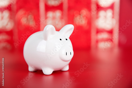 Piggy bank on red background