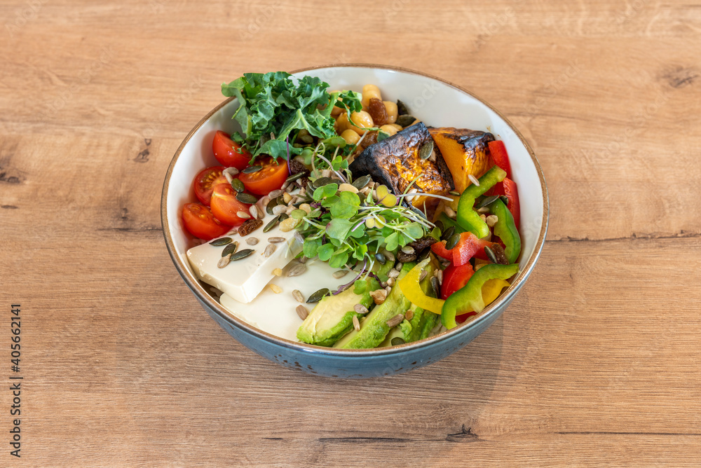 bowl with vegetables and cheese on wooden table bowl with vegetables and cheese on wooden table