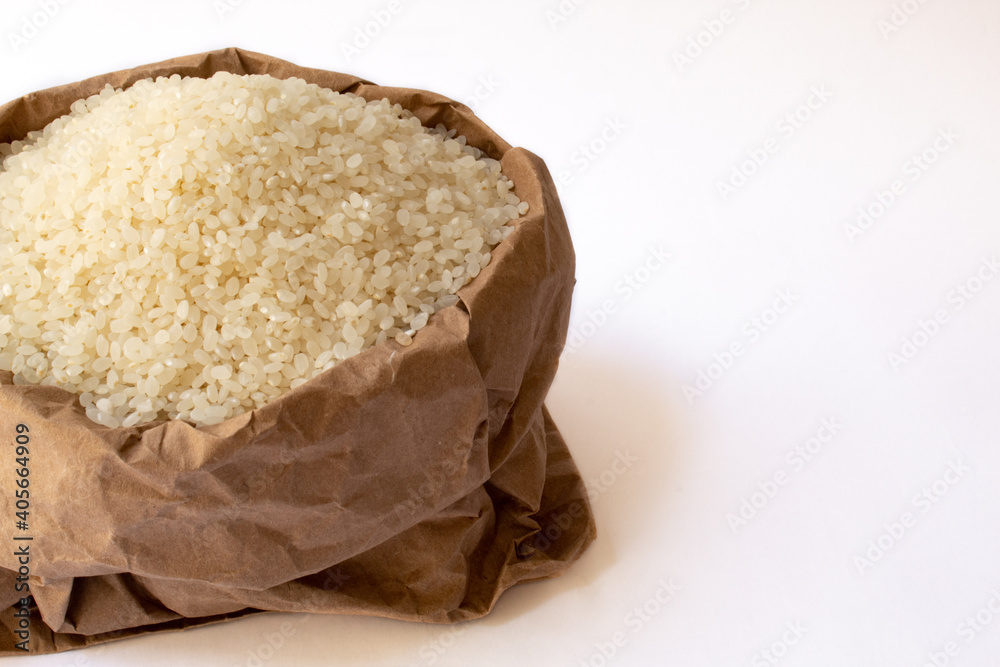Arborio rice in paper bag isolated on white background Arborio rice in paper bag isolated on white background