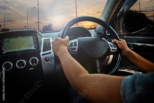Woman holding steering wheel, drives the car © admin_design