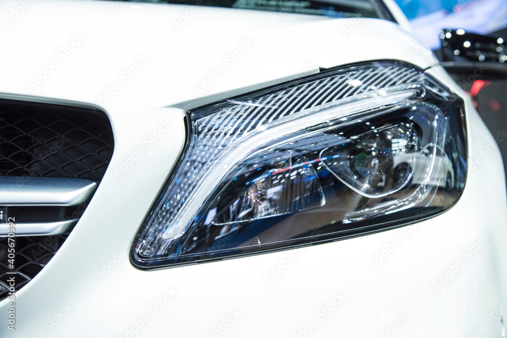 Headlight of a modern luxury car, auto detail,car care concept