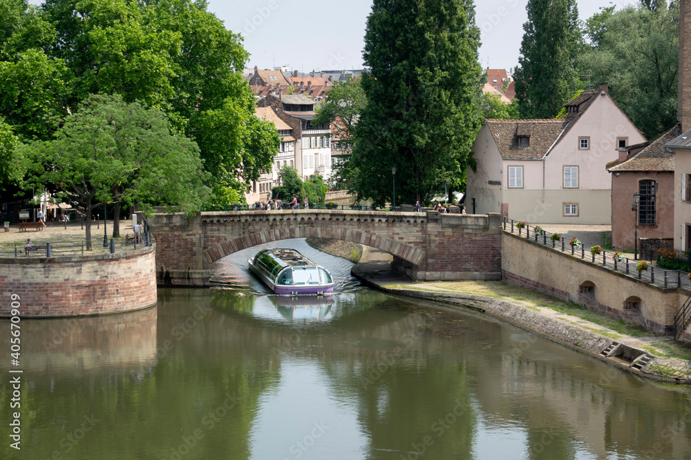 Fototapeta premium Sightseeing boat in Petite France from Ponts Couverts, Strasbourg, France