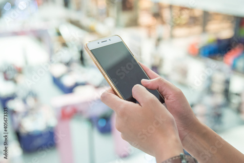 Close up of woman using mobile phone for contact the job