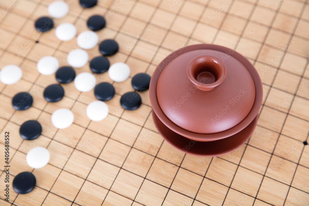 Go and gaiwan tea on the chessboard Go and gaiwan tea on the chessboard