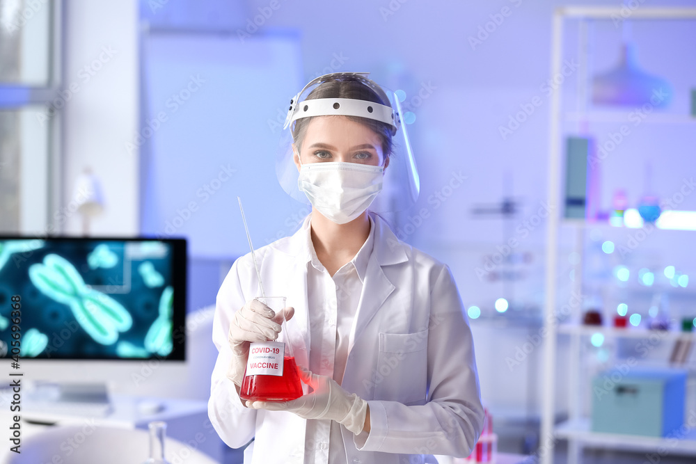 Scientist with covid-19 vaccine in laboratory Scientist with covid-19 vaccine in laboratory