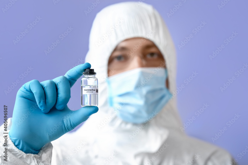 Scientist with covid-19 vaccine in laboratory Scientist with covid-19 vaccine in laboratory