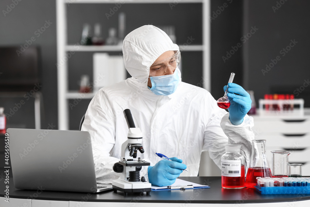 Scientist developing covid-19 vaccine in laboratory Scientist developing covid-19 vaccine in laboratory