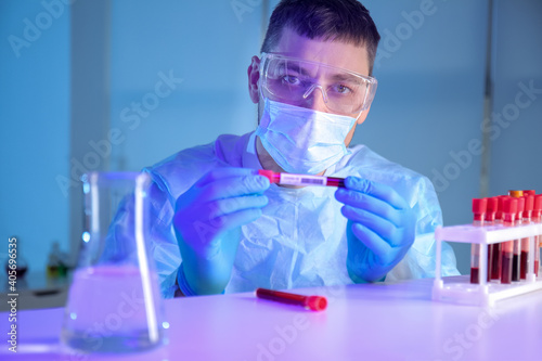 Scientist with sample of co...