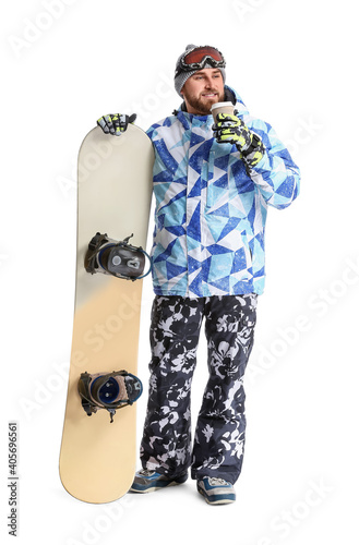 Male snowboarder with coffe...