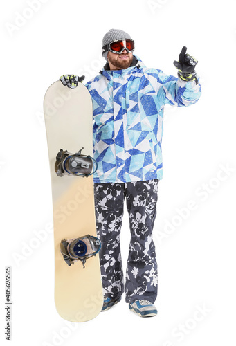 Male snowboarder pointing a...