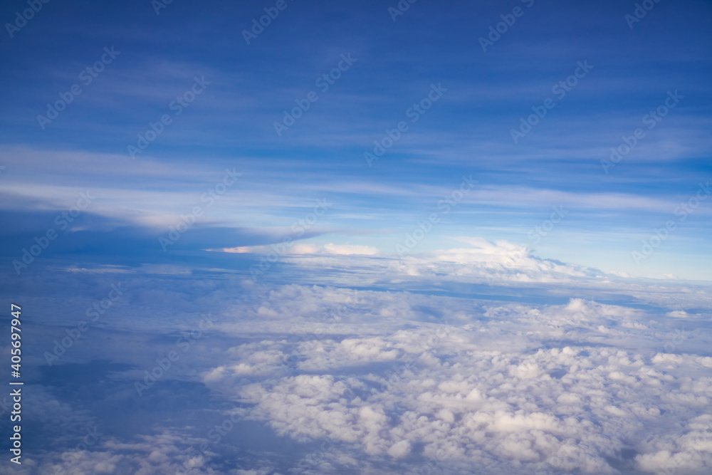 Blue sky and cloud pattern on high sky from window of airplane Blue sky and cloud pattern on high sky from window of airplane