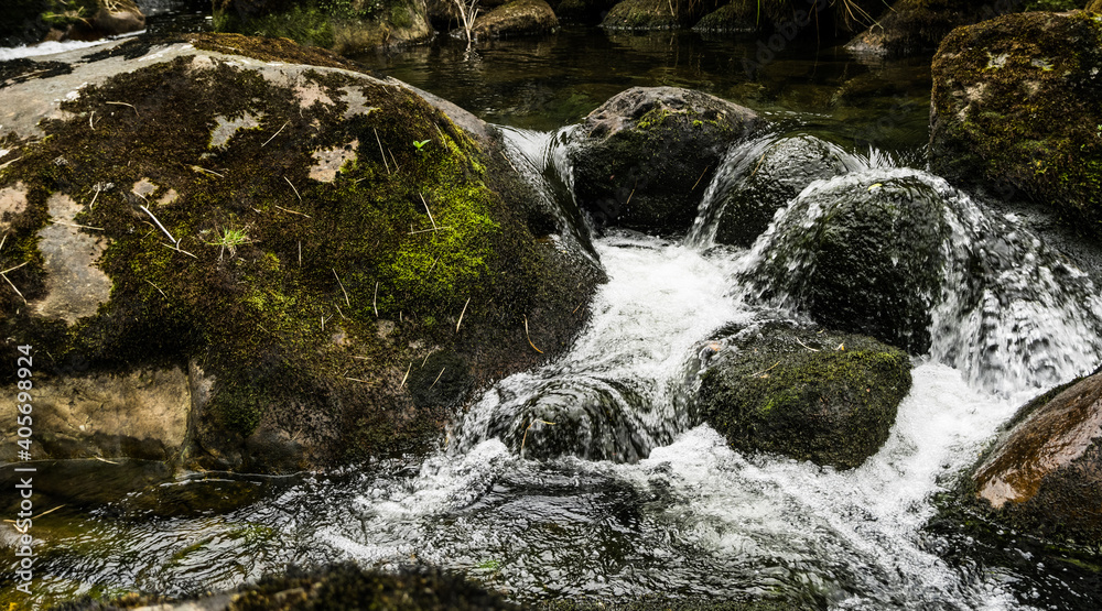 water flowing over rocks water flowing over rocks