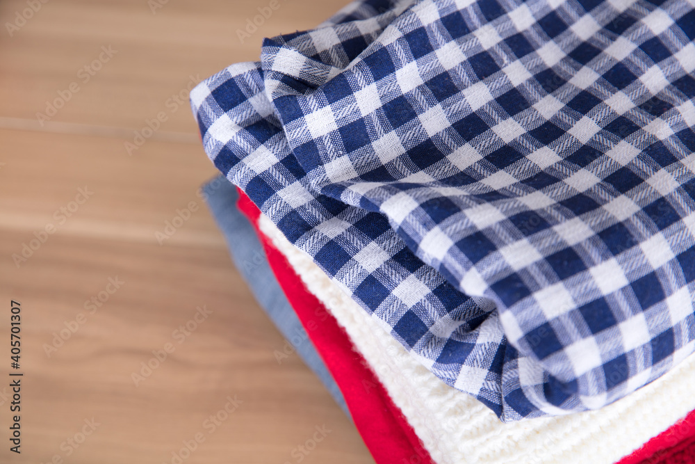 Looking down at the stack of clothes Looking down at the stack of clothes