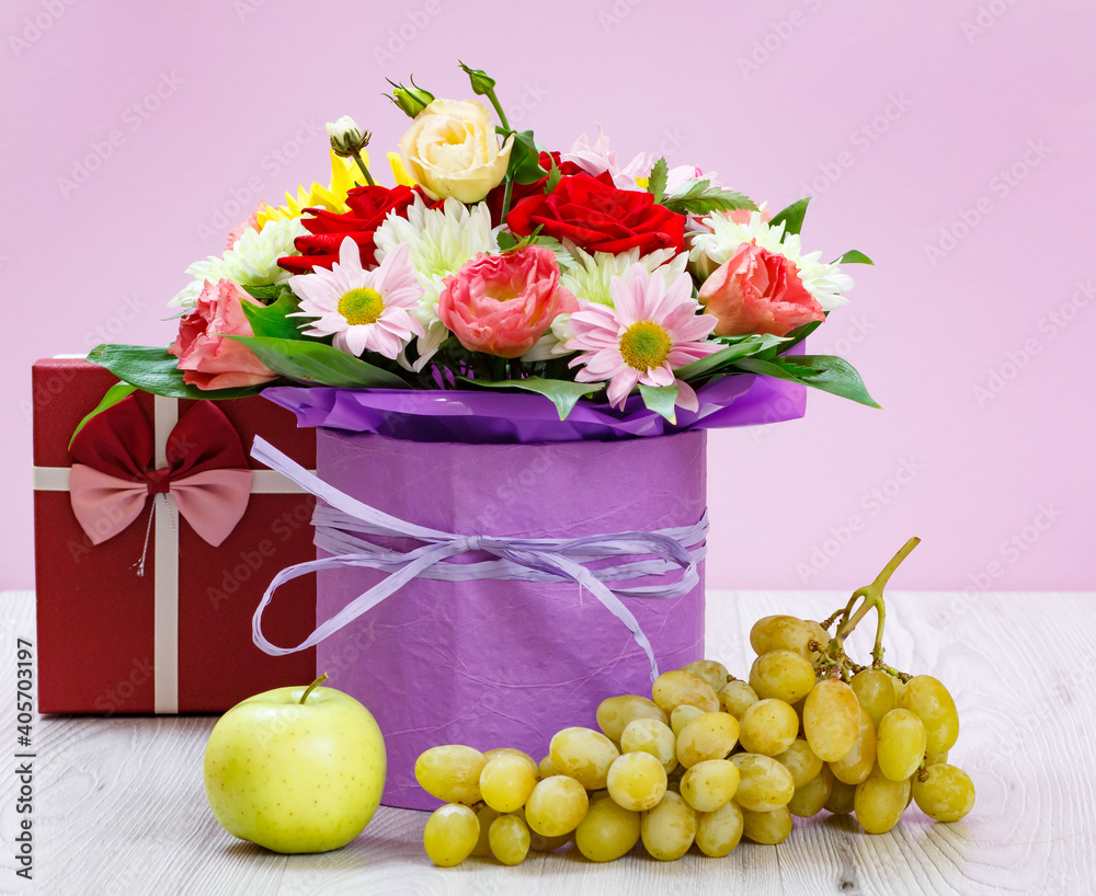 Bouquet of wildflowers and fruits on wooden boards. Bouquet of wildflowers and fruits on wooden boards.