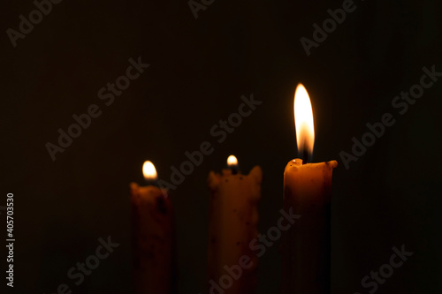A burning candle in the night