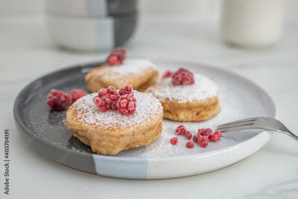 Tasty american pancakes with raspberries on a table Tasty american pancakes with raspberries on a table