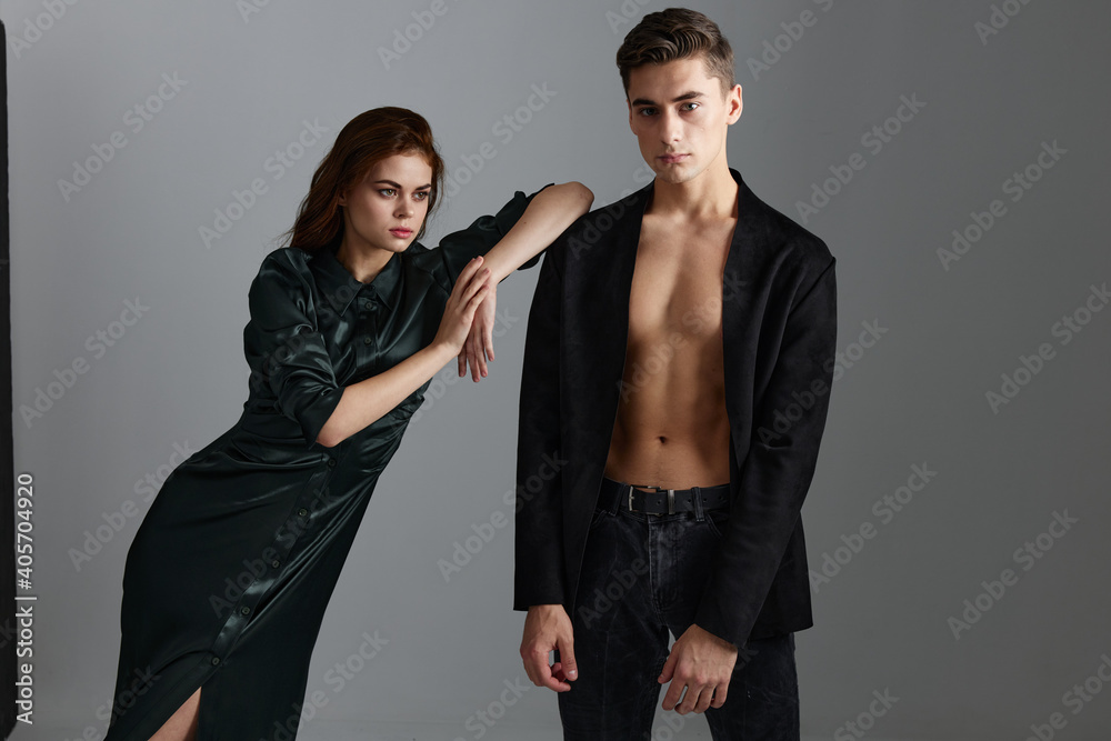 A beautiful woman is leaning on the shoulder of a sexy man in a suit A beautiful woman is leaning on the shoulder of a sexy man in a suit