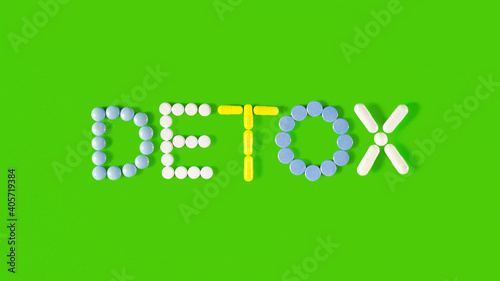 Detox - medical concept. Pharmacology and pharmaceuticals. Pills of various shapes and colors are laid out in the form of the word DETOX