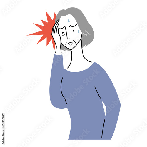 強い頭痛に襲われるシニア女性