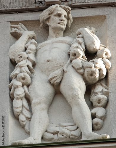 Decor of the facade of the building with sculptures and busts of people © SERHII BLIK