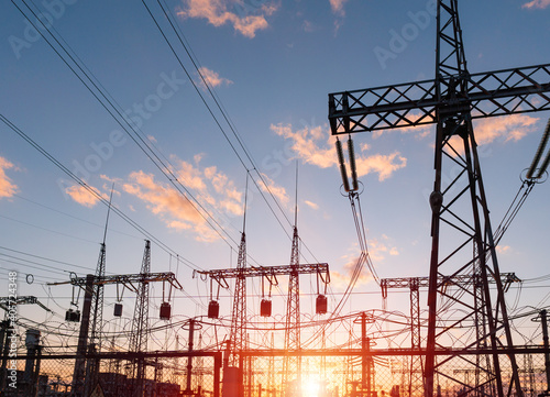 High voltage electric transmission tower. Distribution electric substation with power lines and transformers