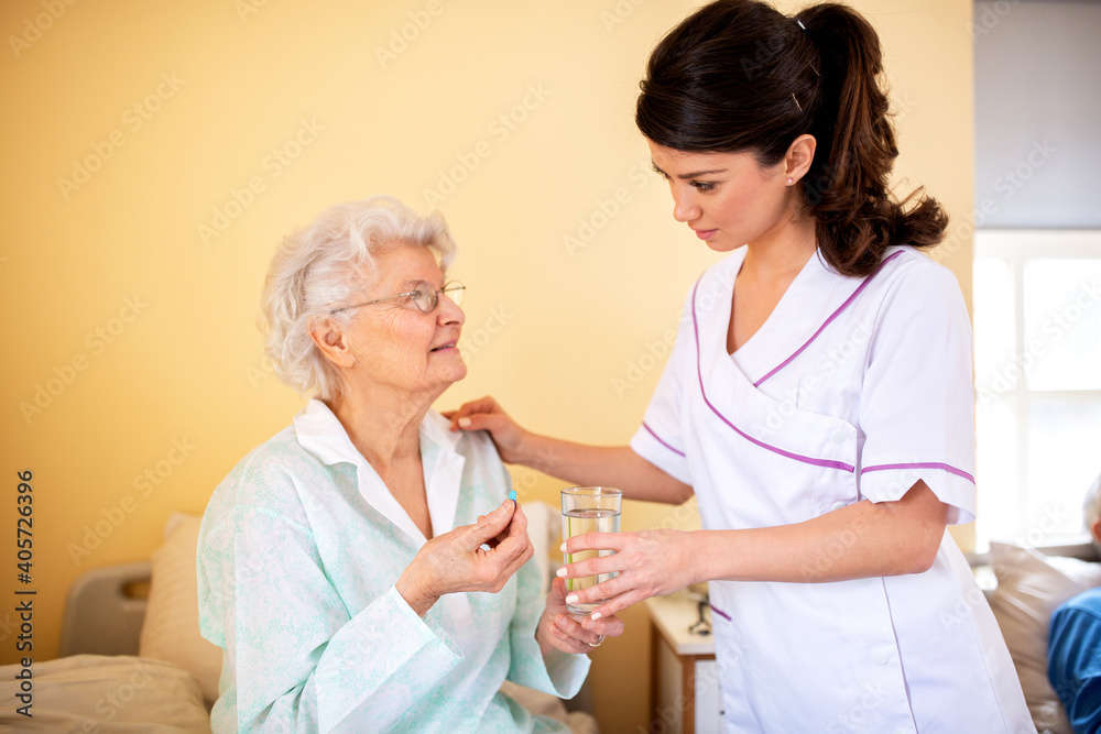 Two ladies working together, doctor and her nursing facility patient Two ladies working together, doctor and her nursing facility patient