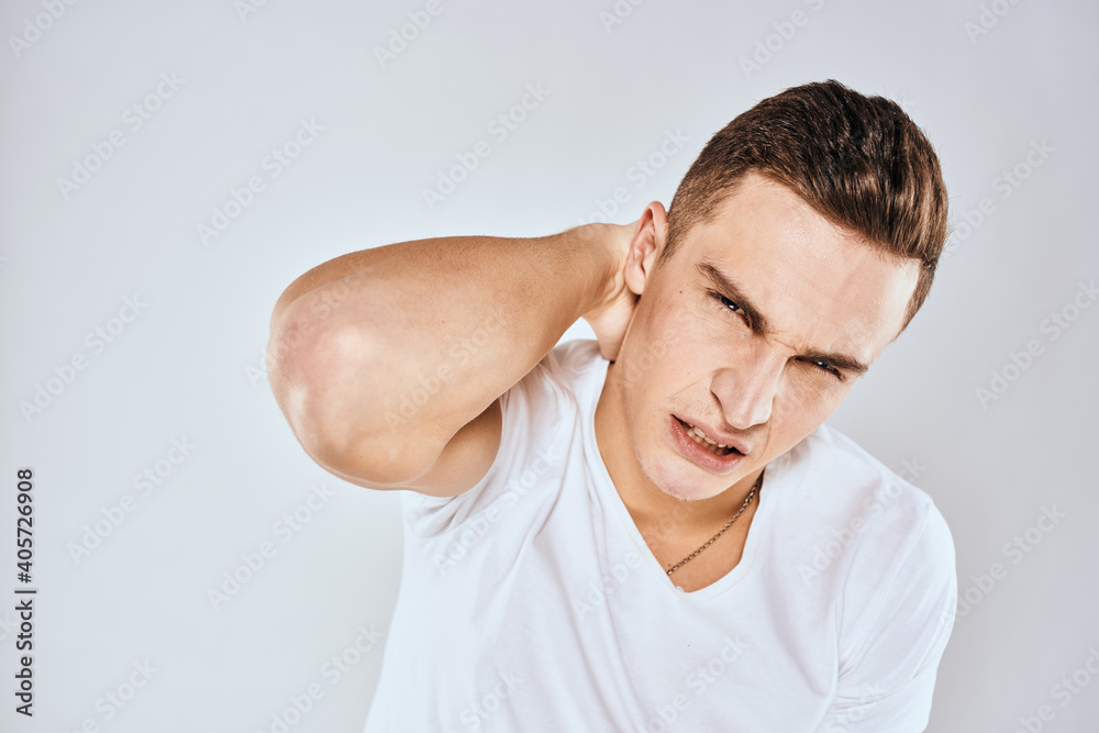 emotional man gesturing with his hands displeased facial expression white t-shirt cropped emotional man gesturing with his hands displeased facial expression white t-shirt cropped
