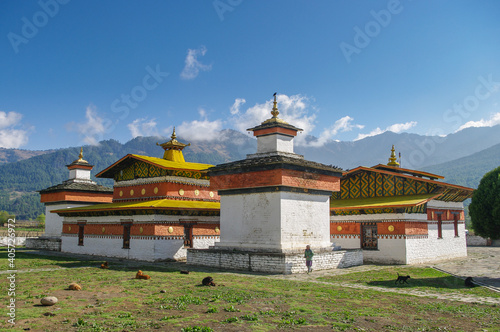 Landscape view of beautiful historical Jampey lhakhang temple complex with chorten on mountain background in Bumthang valley, Bhutan