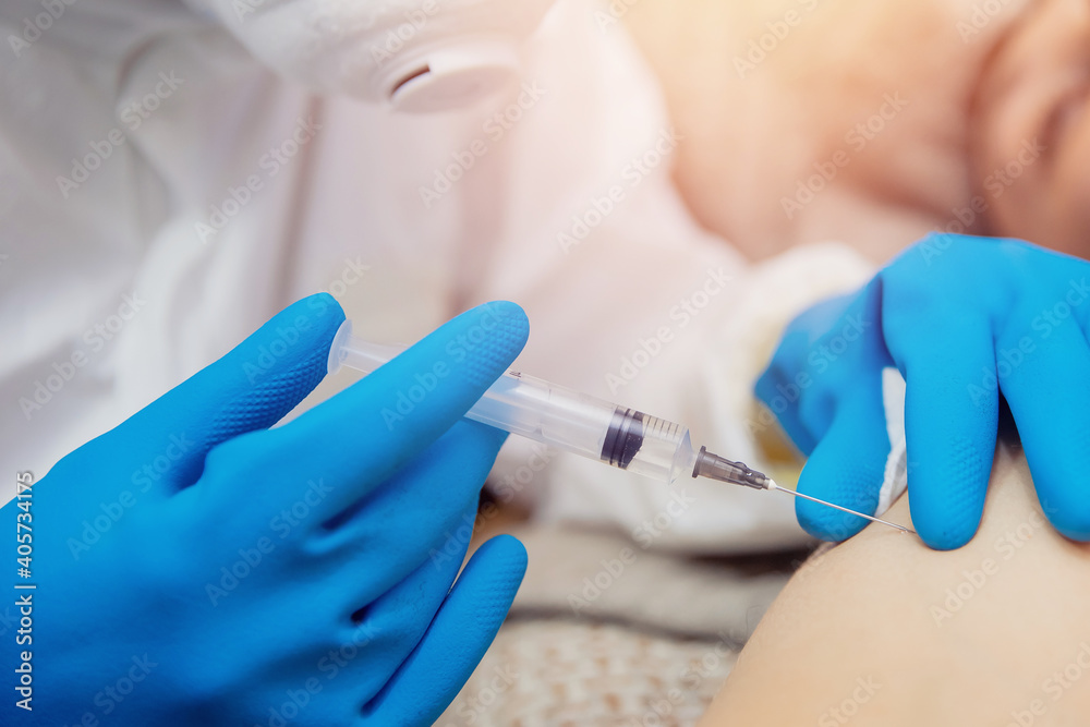 Close-up vaccination inoculation of patient in shoulder, syringe with covid vaccine flu is injected into sick man Close-up vaccination inoculation of patient in shoulder, syringe with covid vaccine flu is injected into sick man
