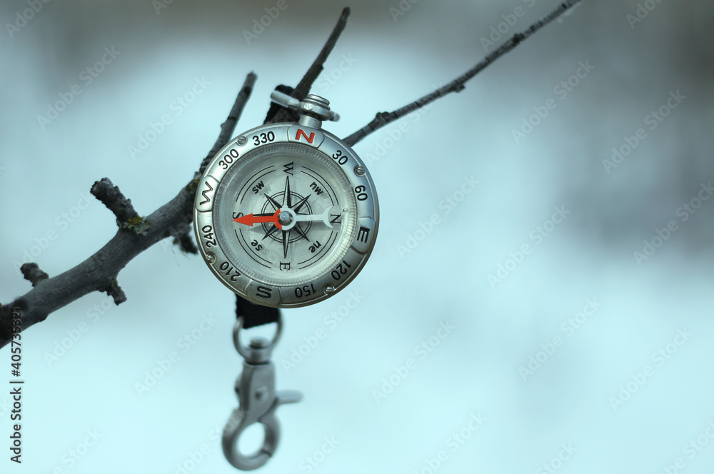 Classic navigation compass on natural background as symbol of tourism with compass, travel with compass and outdoor activities with compass Classic navigation compass on natural background as symbol of tourism with compass, travel with compass and outdoor activities with compass